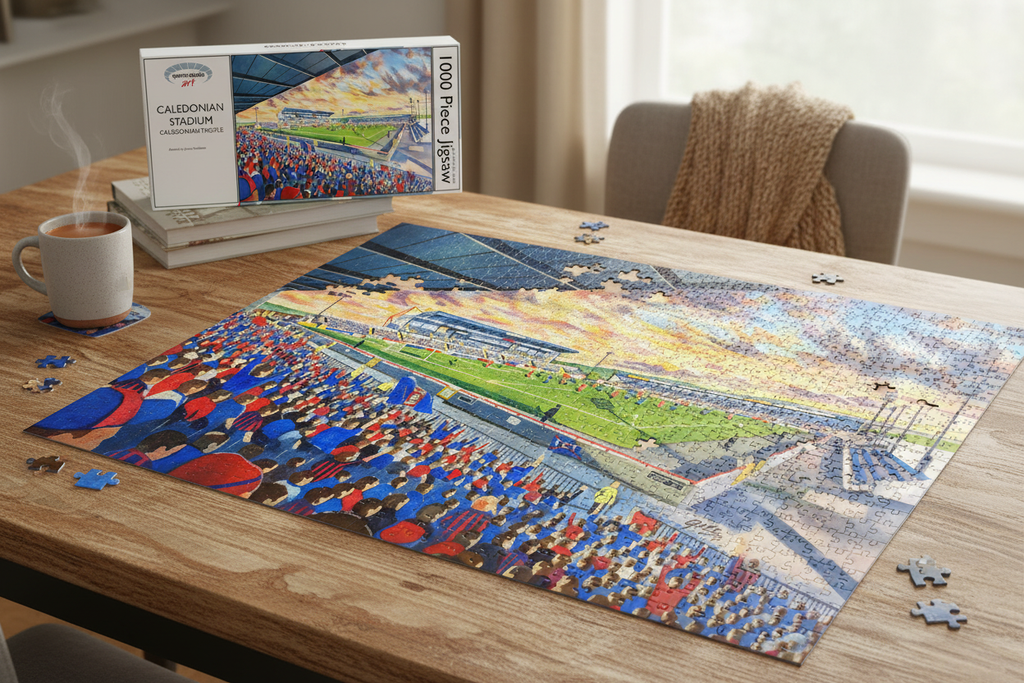 Caledonian Stadium Caledonian Thistle 1000 piece jigsaw puzzle partially assembled on a table with box and mug of tea